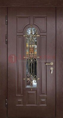 Темная железная дверь со стеклом и ковкой для частного дома ДСК-156 в Люберцах